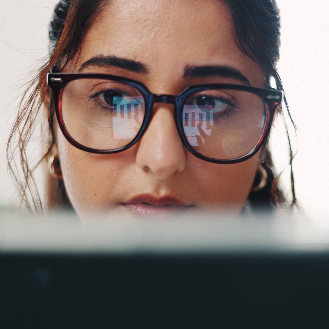 Woman looking at screen trying to work something out